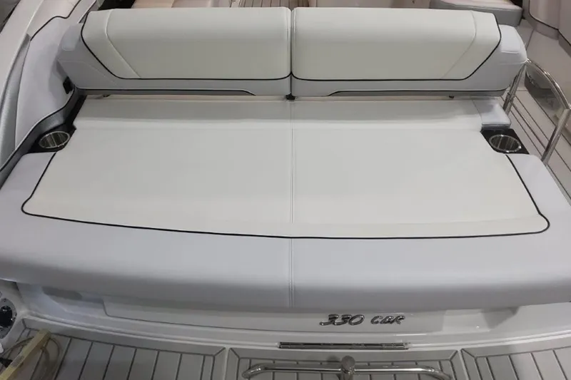 Slide: The Image of 2026 Formula 330 Crossover Bowrider I/O boat with sleek seating and cup holders. - 9