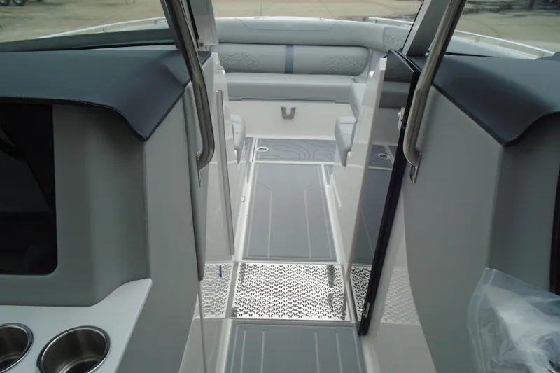 Slide: The Image of Interior view of 2026 Regal LX36 boat, featuring sleek seating and modern design elements. - 17