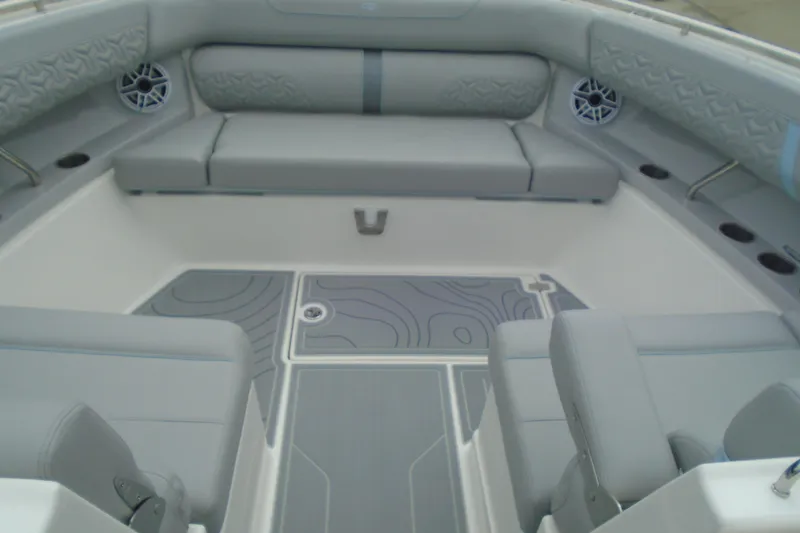 Slide: The Image of 2026 Regal LX36 boat interior with gray seating and modern design. - 18