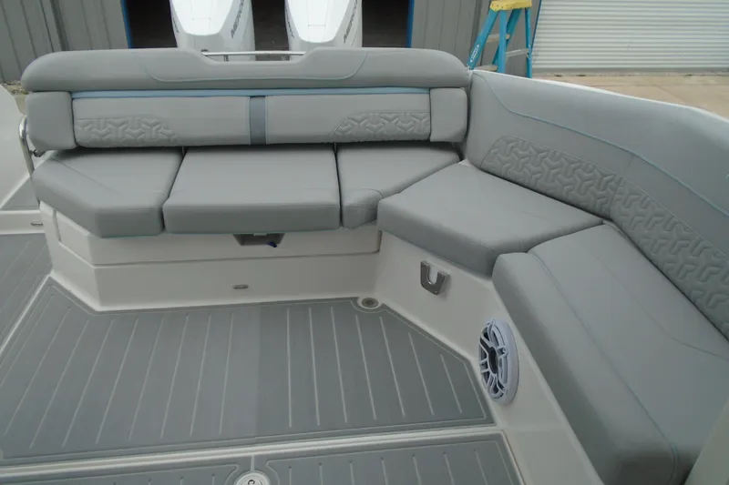 Slide: The Image of 2026 Regal LX36 boat interior with gray cushioned seating and modern design. - 22