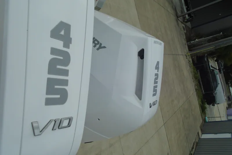 Slide: The Image of Outboard engines labeled "425 V10" on a 2026 Regal LX36 boat. - 27