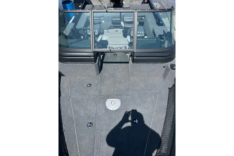 Slide: The Image of 2026 Lund 1875 Impact XS Sport boat interior with seating and windshield. - 12