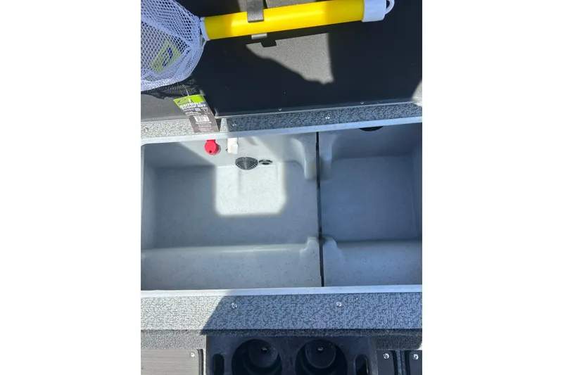 Slide: The Image of 2026 Lund 1875 Impact XS Sport boat interior storage compartment with fishing net. - 15