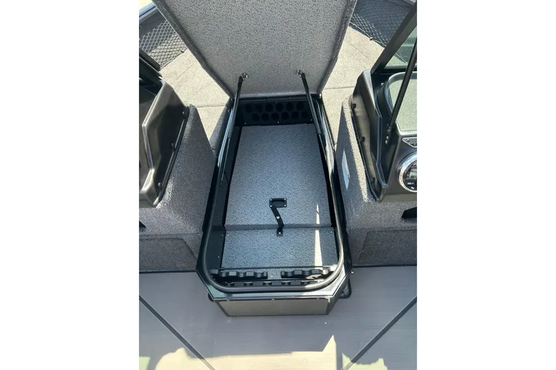 Slide: The Image of 2026 Lund 1875 Impact XS Sport boat storage compartment, open and empty. - 21