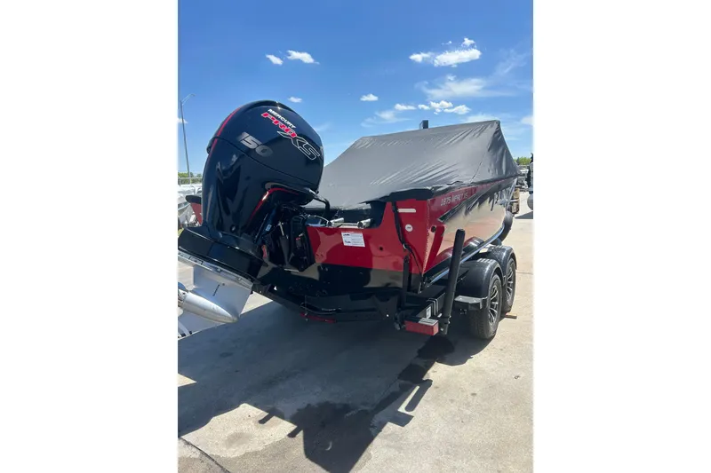 Slide: The Image of 2026 Lund 1875 Impact XS Sport boat with cover and powerful outboard motor. - 9