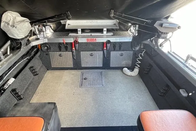 Slide: The Image of Interior of a 2018 Thunder Jet Luxor Limited boat, featuring storage compartments and seating. - 11