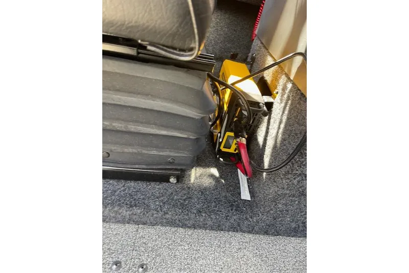 Slide: The Image of Interior of 2018 Thunder Jet Luxor Limited with battery cables and equipment. - 15