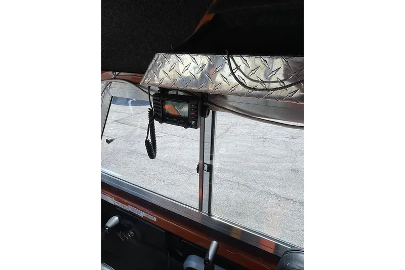 Slide: The Image of Interior view of a 2018 Thunder Jet Luxor Limited boat with mounted radio equipment. - 16