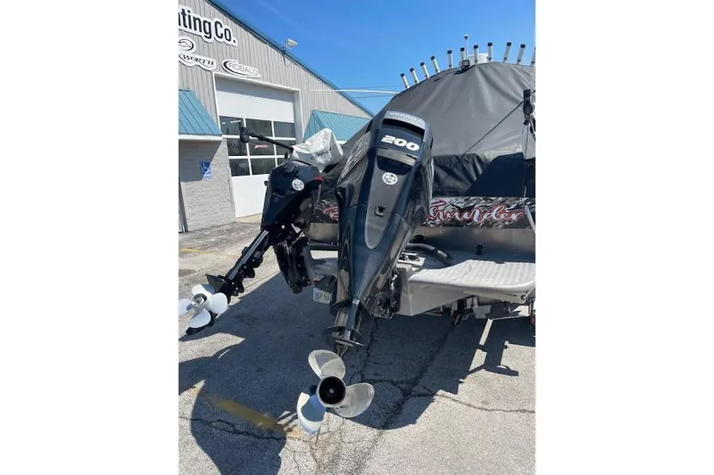 Slide: The Image of 2018 Thunder Jet Luxor Limited boat with dual outboard motors at a dealership. - 17