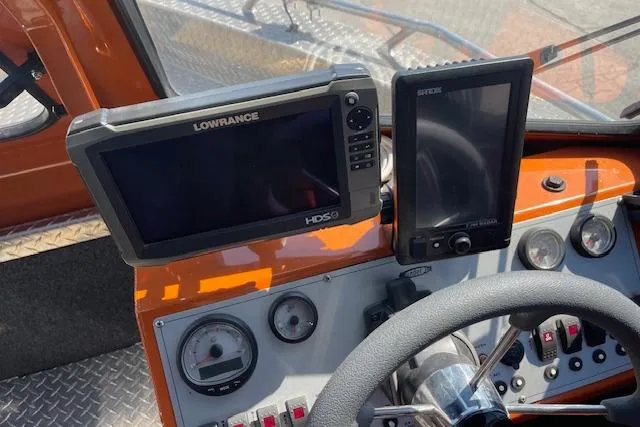 Slide: The Image of Dashboard of 2018 Thunder Jet Luxor Limited boat with navigation screens and controls. - 5