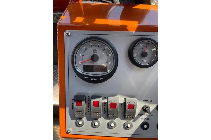 Slide: The Image of Dashboard of a 2018 Thunder Jet Luxor Limited boat with gauges and switches. - 6