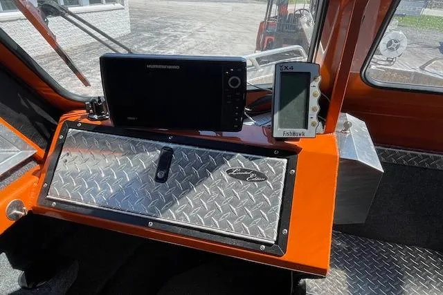 Slide: The Image of 2018 Thunder Jet Luxor Limited dashboard with navigation and fish finder displays. - 8