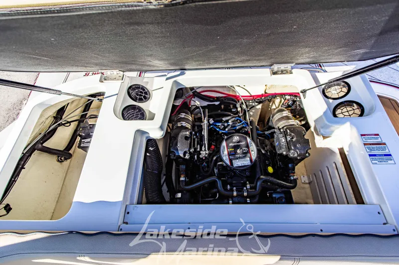 Slide: The Image of Engine compartment of a 2016 Sea Ray SPX 190 boat, featuring a MerCruiser engine. - 13