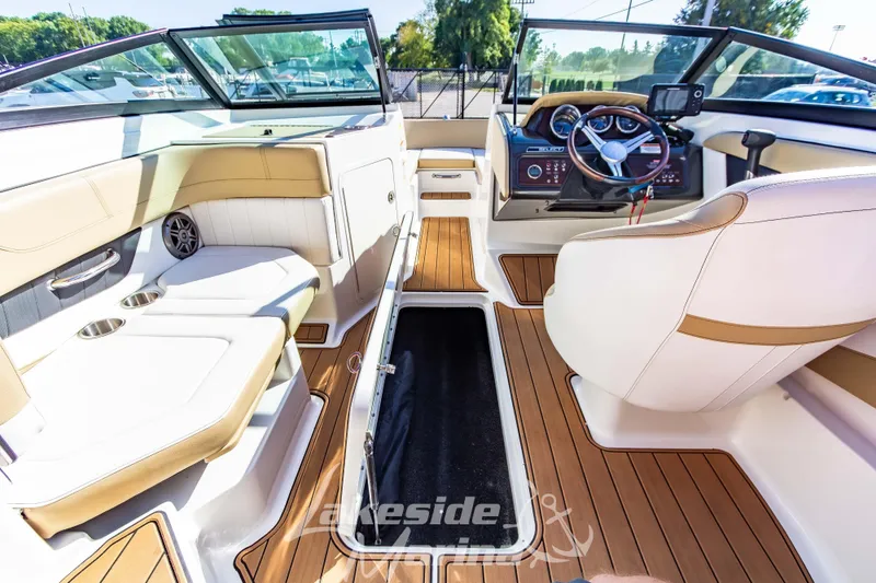 Slide: The Image of Interior of a 2016 Sea Ray SPX 190 boat with seating and steering wheel. - 15