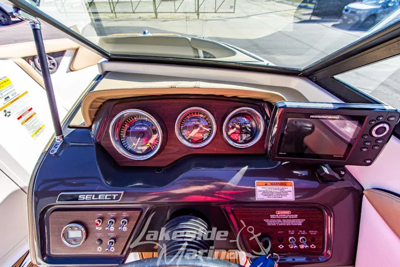 Slide: The Image of Dashboard of a 2016 Sea Ray SPX 190 boat with gauges and Humminbird display. - 17