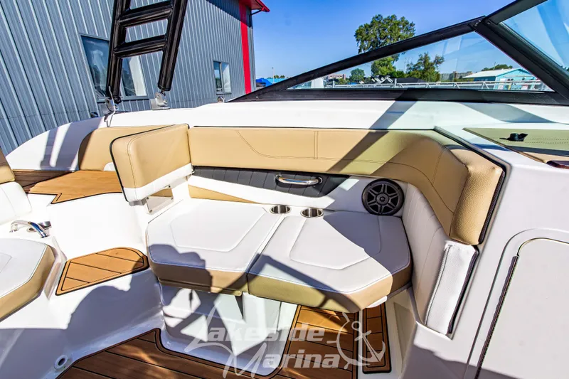 Slide: The Image of Interior of a 2016 Sea Ray SPX 190 boat with tan seating and cup holders. - 21