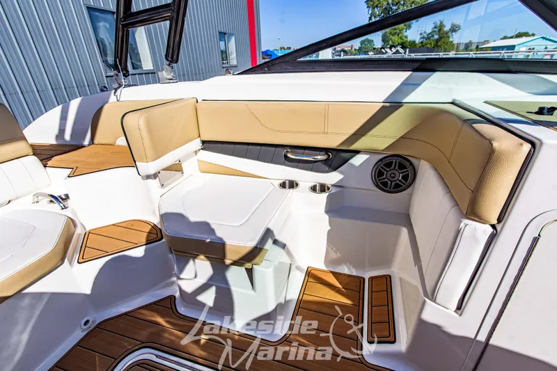 Slide: The Image of Interior of 2016 Sea Ray SPX 190 boat with tan and white seating. - 22