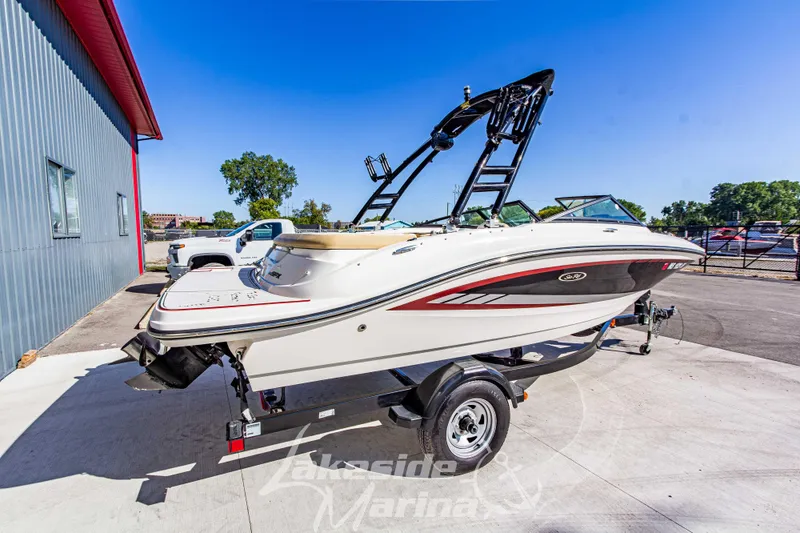 Slide: The Image of 2016 Sea Ray SPX 190 boat on trailer at marina, sunny day. - 3