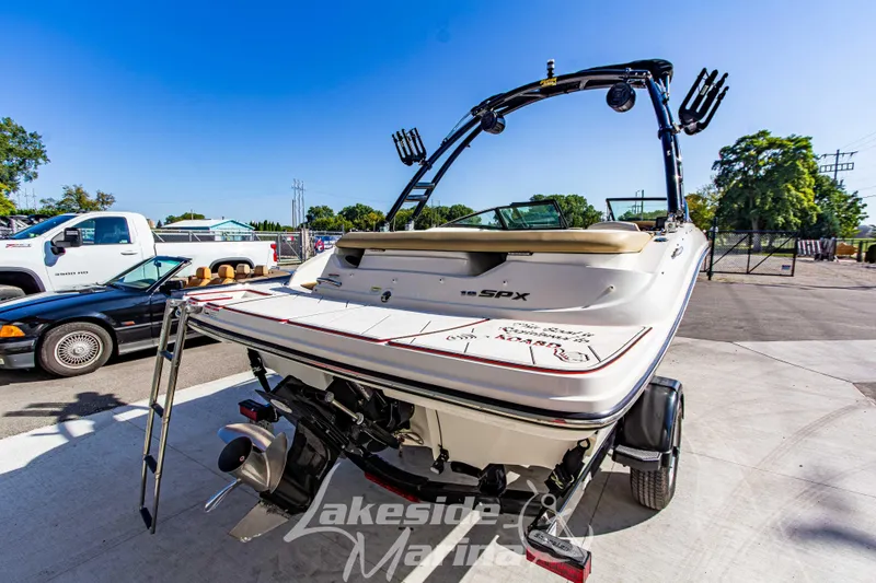 Slide: The Image of 2016 Sea Ray SPX 190 boat with ladder, parked outdoors at Lakeside Marina. - 4