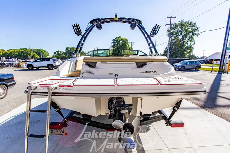 Slide: The Image of 2016 Sea Ray SPX 190 boat at Lakeside Marina, rear view with ladder and propeller. - 5
