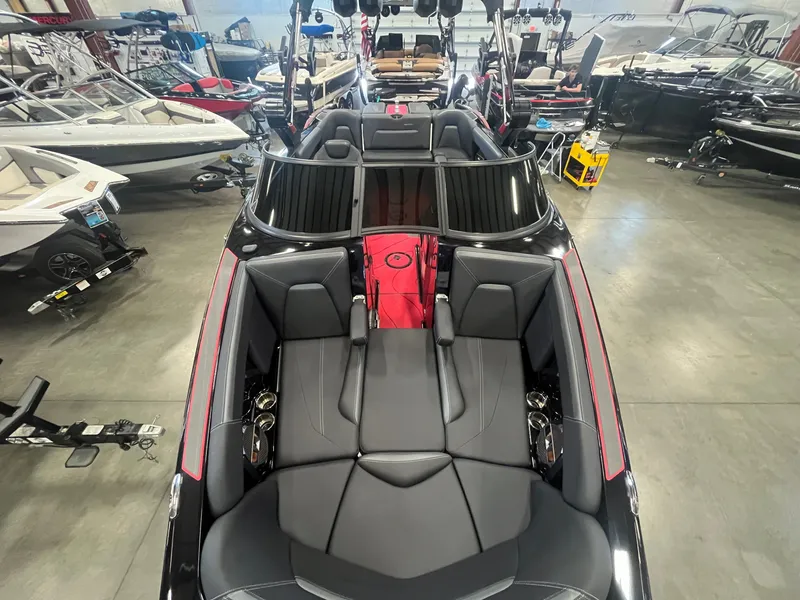 Slide: The Image of 2022 MasterCraft XStar S boat in a showroom. - 16