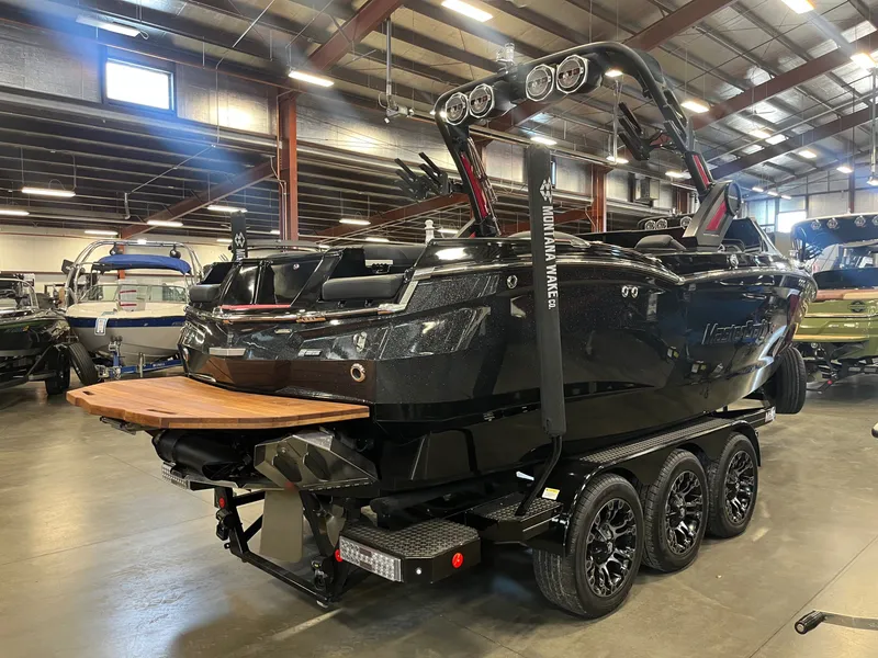 Slide: The Image of 2022 MasterCraft XStar S boat in a warehouse. - 3