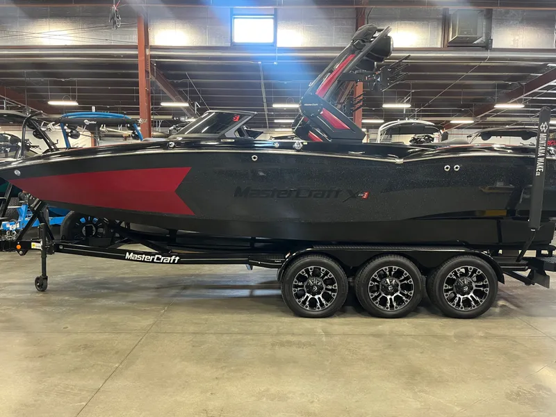 Slide: The Image of 2022 MasterCraft XStar S boat in a warehouse setting. - 6