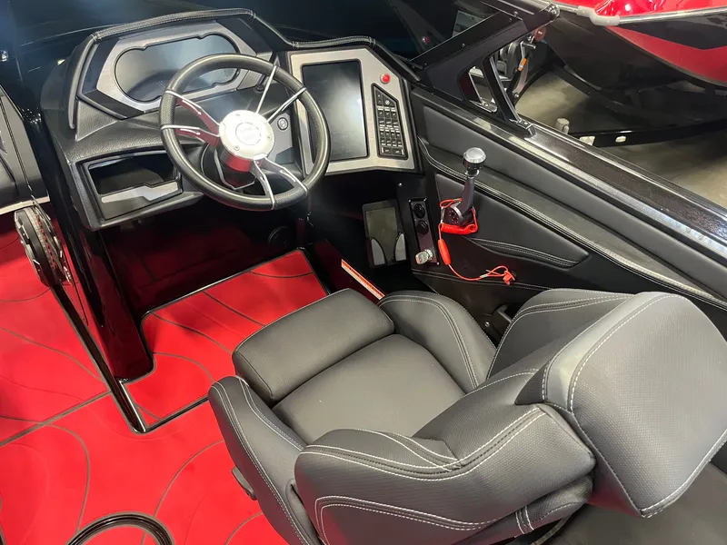 Slide: The Image of Interior of 2022 MasterCraft XStar S with modern helm station. - 9