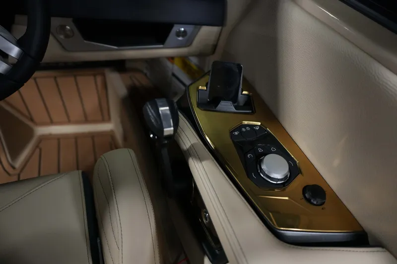 Slide: The Image of 2026 Nautique G25 interior with sleek control console. - 12