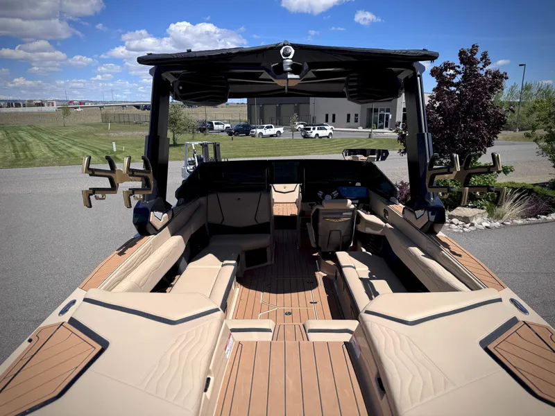 Slide: The Image of Interior view of 2026 Nautique G25 boat with luxurious seating area. - 20