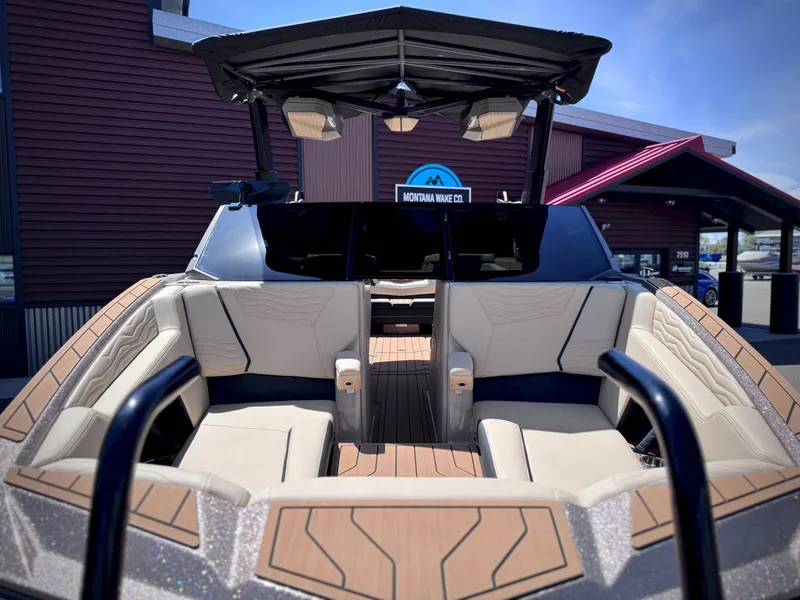 Slide: The Image of Interior view of 2026 Nautique G25 boat with luxurious seating. - 27