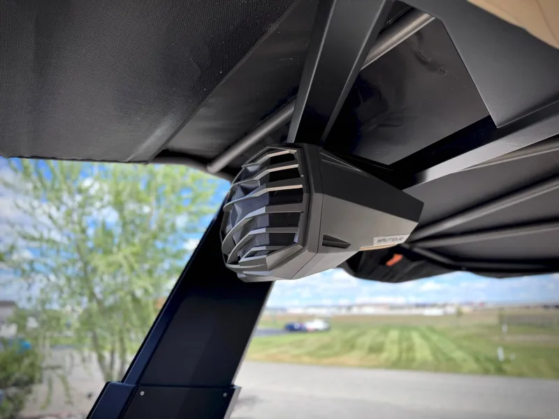 Slide: The Image of Nautique G25 2026 speaker under boat canopy. - 29