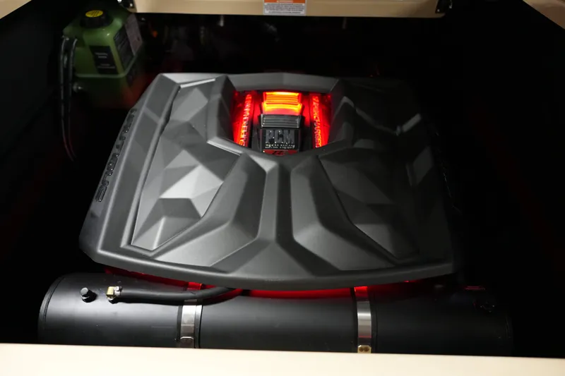 Slide: The Image of 2026 Nautique G25 engine cover with red lighting. - 7