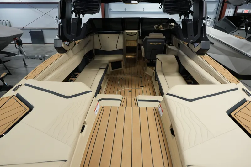 Slide: The Image of Interior of 2026 Nautique G25 with luxurious seating design. - 8