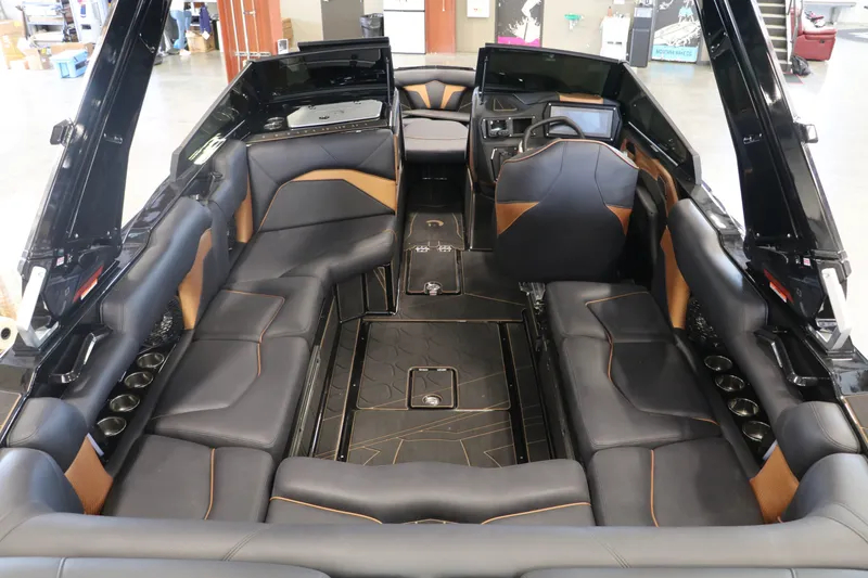 Slide: The Image of Interior of 2025 Centurion Fe23 with luxurious black leather seating. - 10