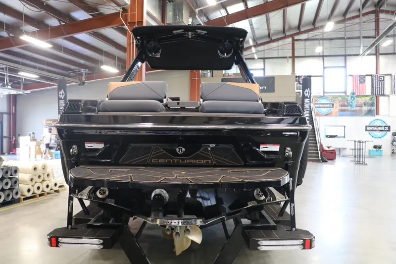 Slide: The Image of 2025 Centurion Fe23 boat in showroom, rear view. - 4