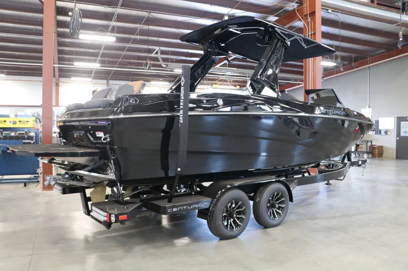 Slide: The Image of 2025 Centurion Fe23 boat in a warehouse on a trailer. - 5