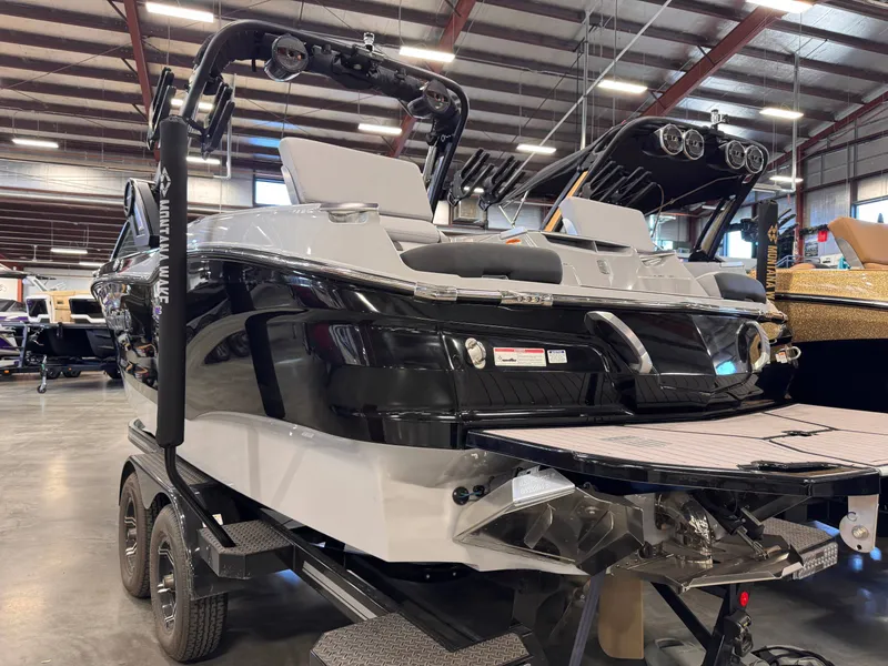Slide: The Image of 2023 MasterCraft X24 boat in a warehouse setting. - 3