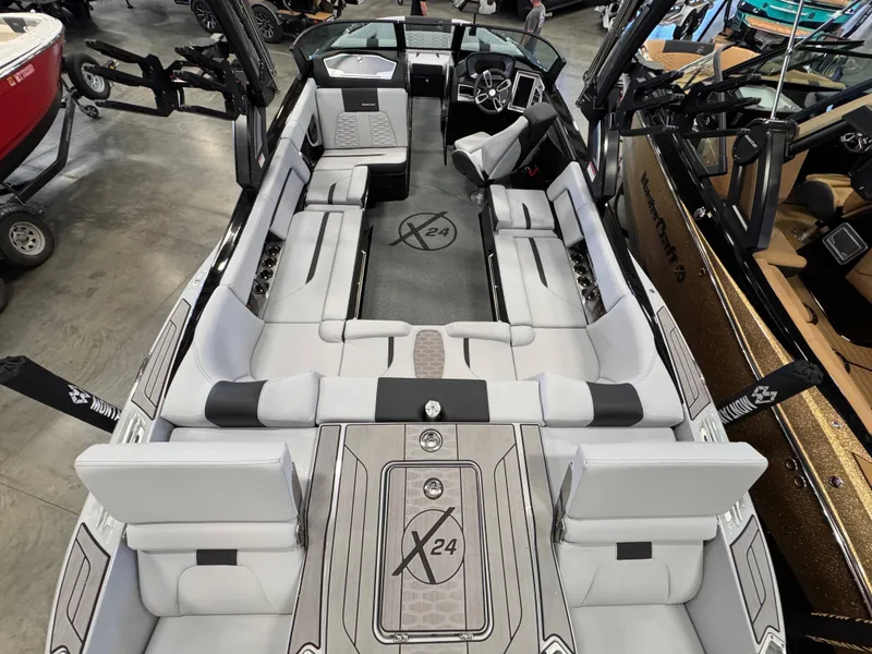 Slide: The Image of Interior view of 2023 MasterCraft X24 boat with luxurious seating arrangement. - 4
