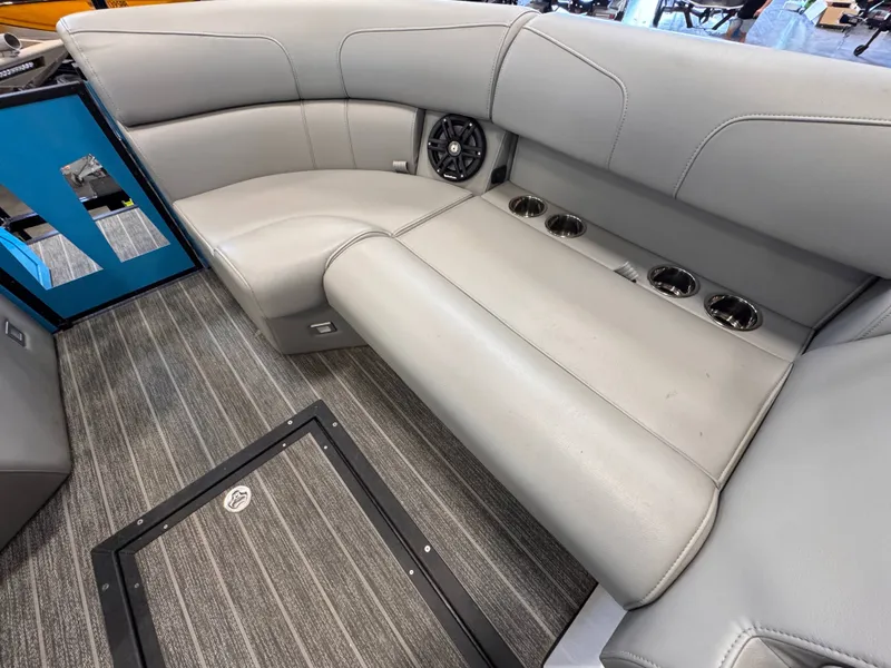 Slide: The Image of Interior of Montara Surf Boss 2.0 boat, gray upholstery, speaker, and cup holders. - 9