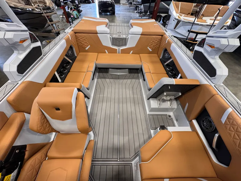 Slide: The Image of Interior of 2026 Nautique Super Air Nautique GS22 with luxurious seating. - 13