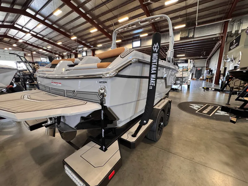 Slide: The Image of 2026 Nautique Super Air Nautique GS22 in a warehouse setting. - 5