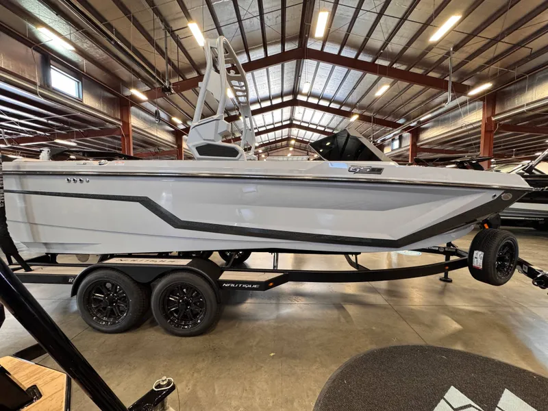 Slide: The Image of 2026 Nautique Super Air Nautique GS22 boat in a warehouse. - 6