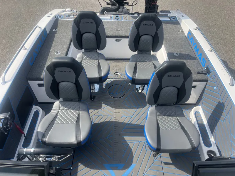 Slide: The Image of Interior of 2024 Caymas DV 22 boat with four gray seats. - 10