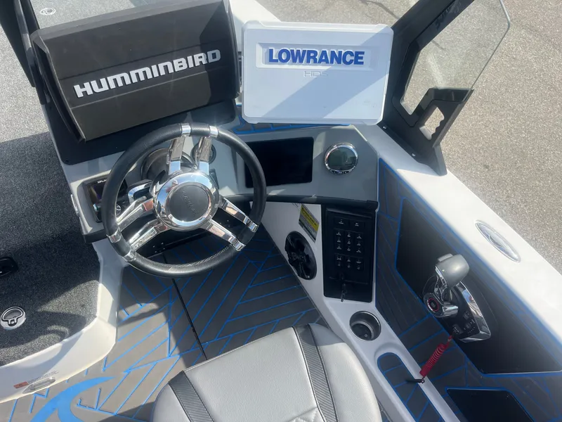 Slide: The Image of Interior view of 2024 Caymas DV 22 boat with steering and electronics. - 11