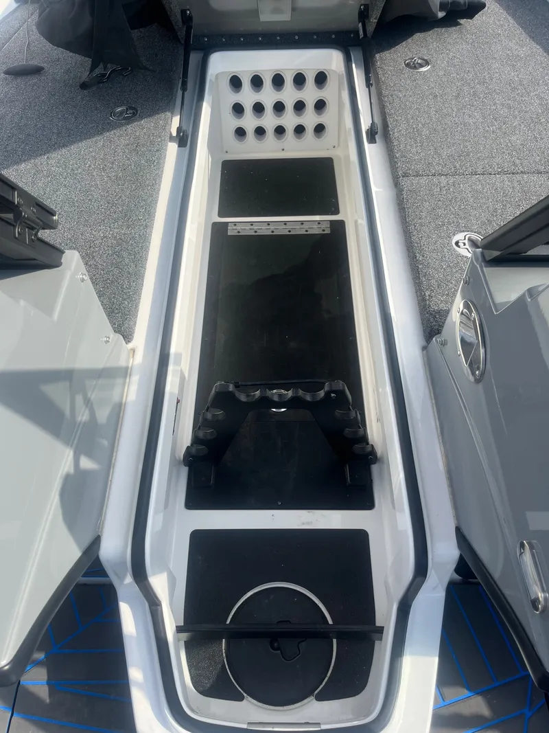 Slide: The Image of Interior view of 2024 Caymas DV 22 boat storage compartment. - 14