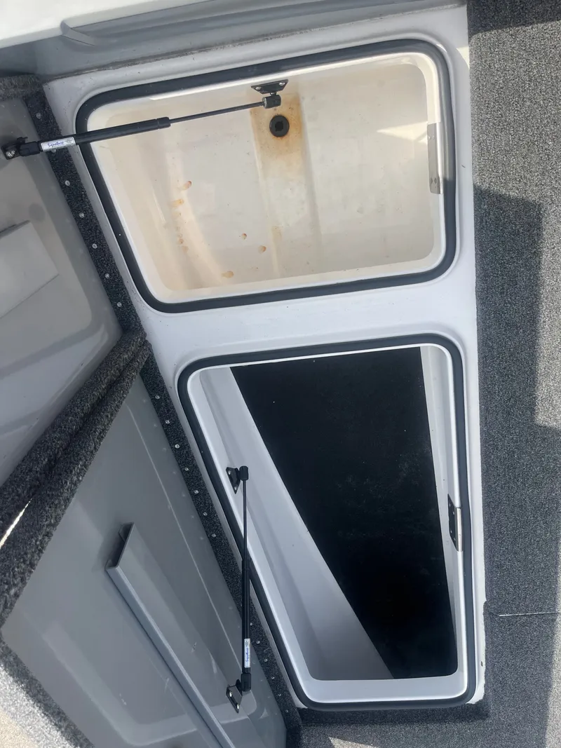 Slide: The Image of Interior view of 2024 Caymas DV 22 boat storage compartment. - 16