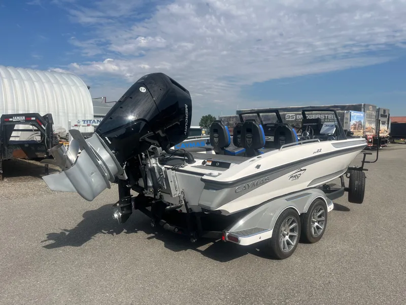 Slide: The Image of 2024 Caymas DV 22 boat with outboard motor on trailer. - 3