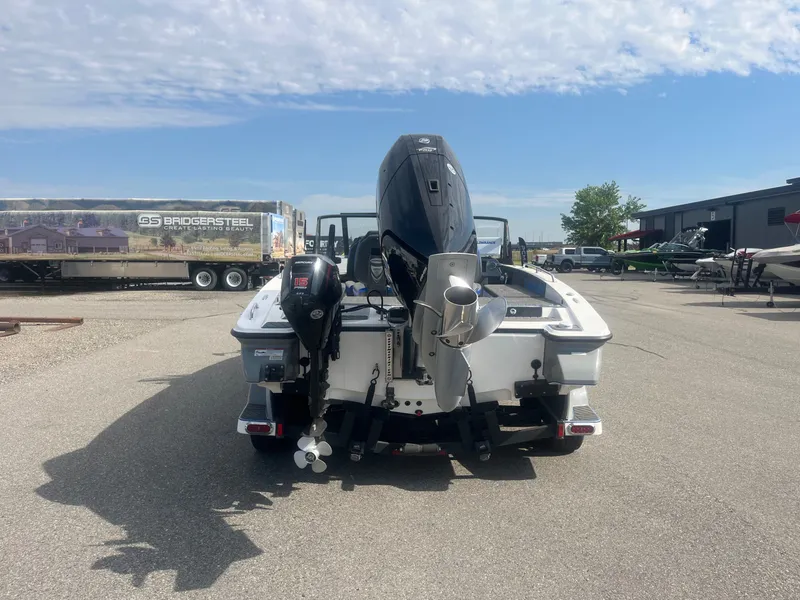 Slide: The Image of Rear view of a 2024 Caymas DV 22 boat in a parking lot. - 4