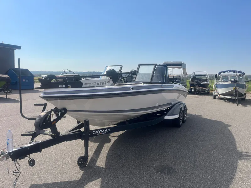 Slide: The Image of 2024 Caymas DV 22 boat parked on trailer outdoors. - 7